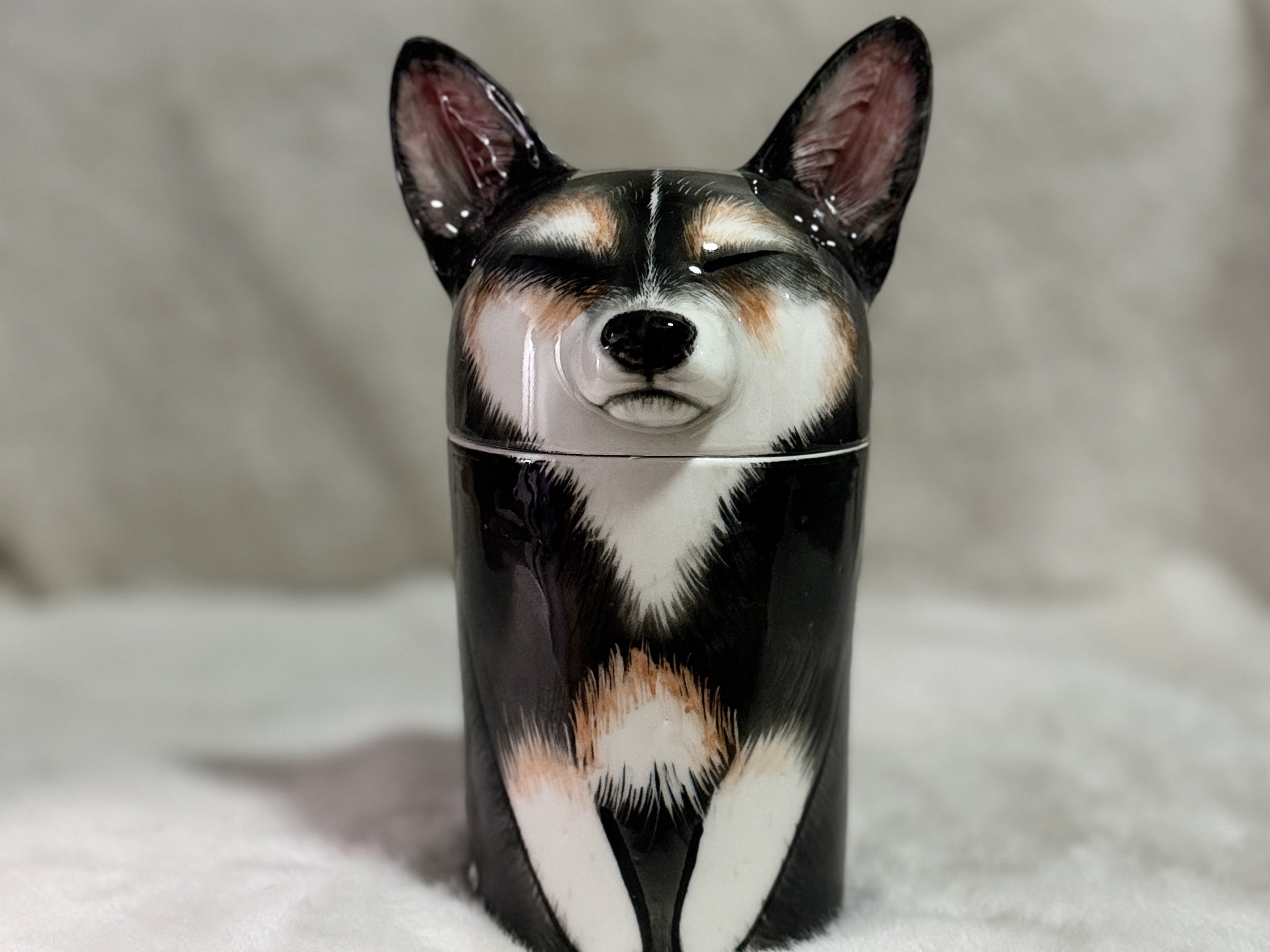 Tumbler with a dog design on a soft surface