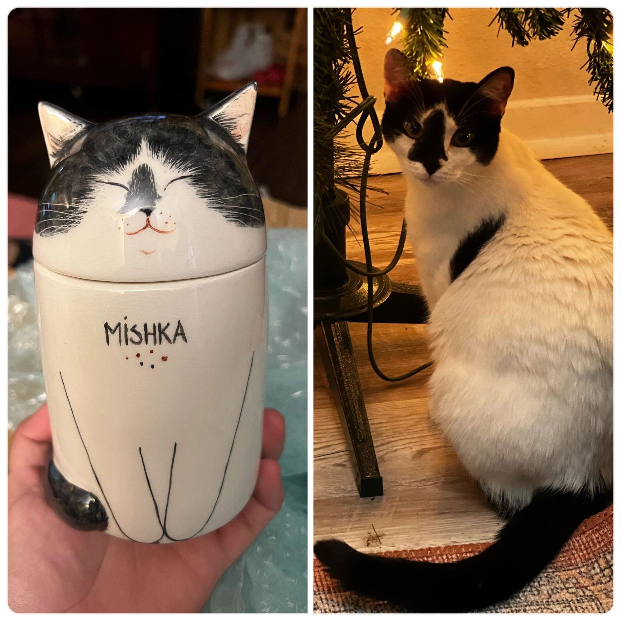 Personalized ceramic cat memorial urn with hand-painted paw print detail