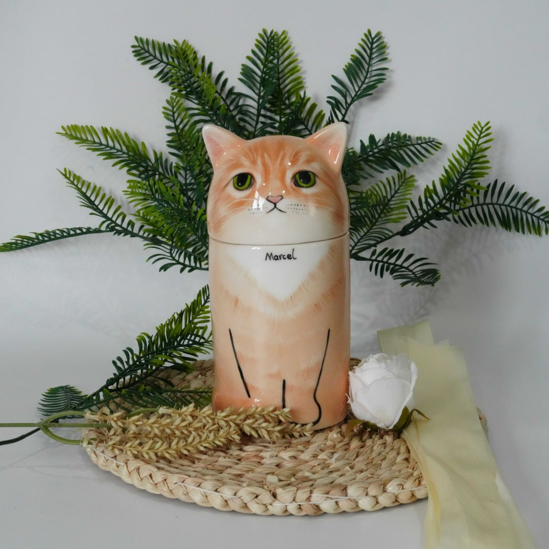 Cat-shaped container with a white rose and green leaves on a woven mat