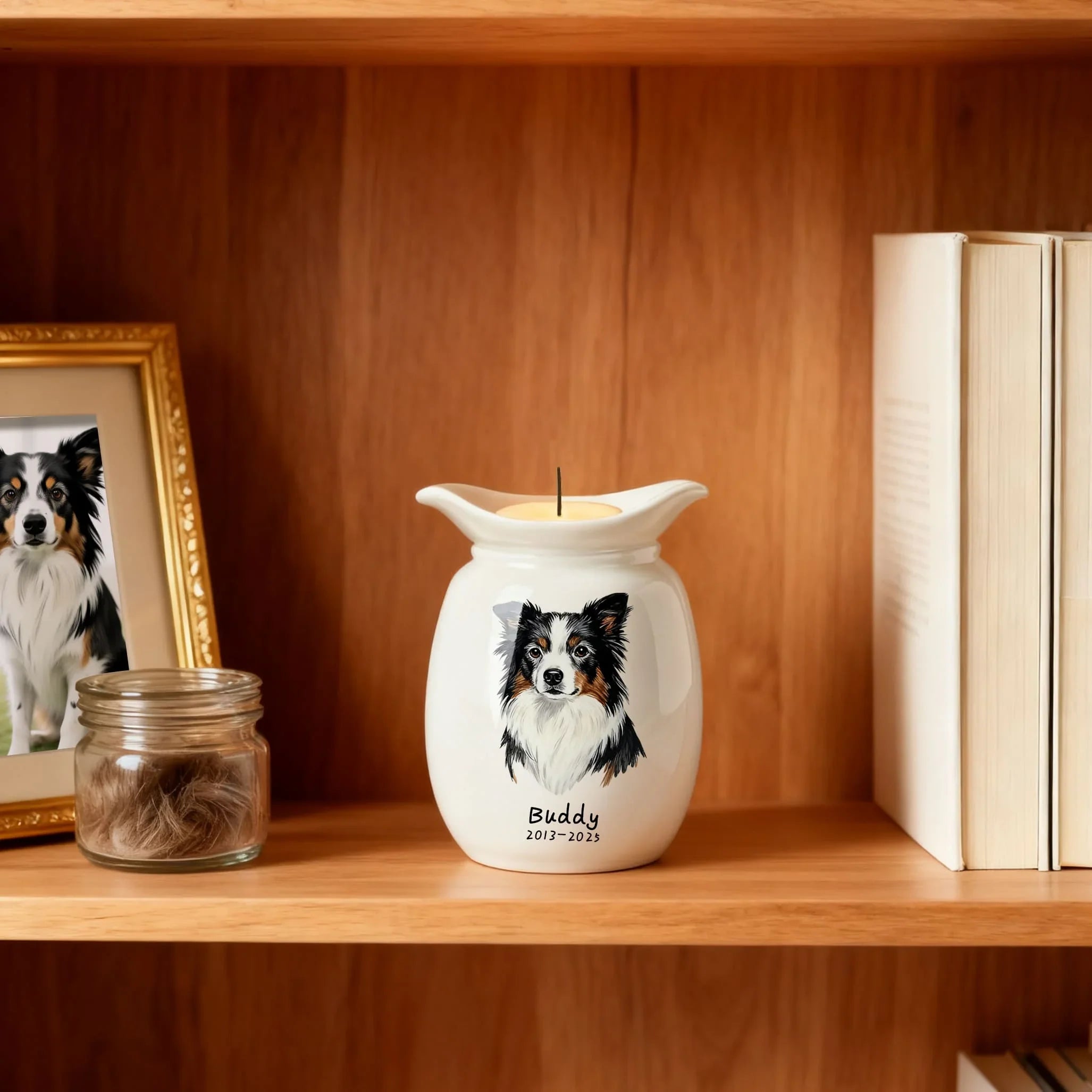 White wax warmer with a dog illustration and 'Buddy' text on a wooden shelf with books and a photo frame.